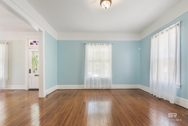 1206 Palmetto St, Mobile, AL 36604 - spare room with wood-type flooring and baseboards