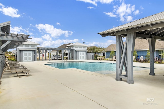 1044 Hayward Loop, Foley, AL 36535 - community pool featuring a pergola, an outdoor structure, and a patio