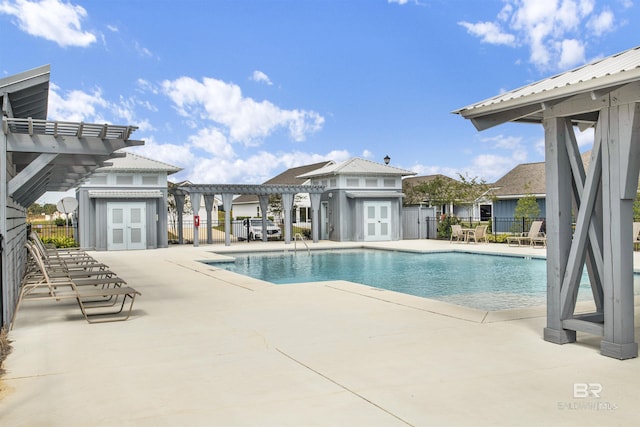 1044 Hayward Loop, Foley, AL 36535 - community pool with a pergola, a patio, an outbuilding, and french doors