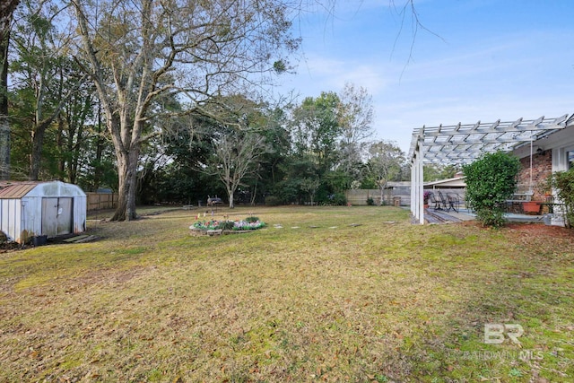 view of yard featuring a pergola and a storage shed