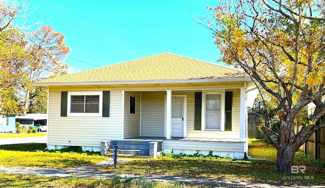 bungalow-style house featuring a front yard and a porch