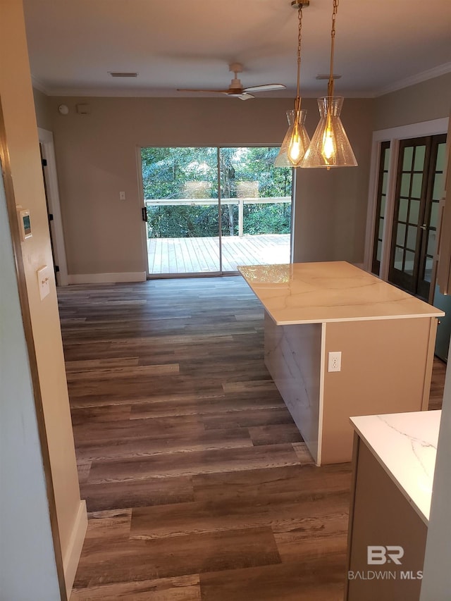 interior space featuring crown molding, dark wood-type flooring, and ceiling fan