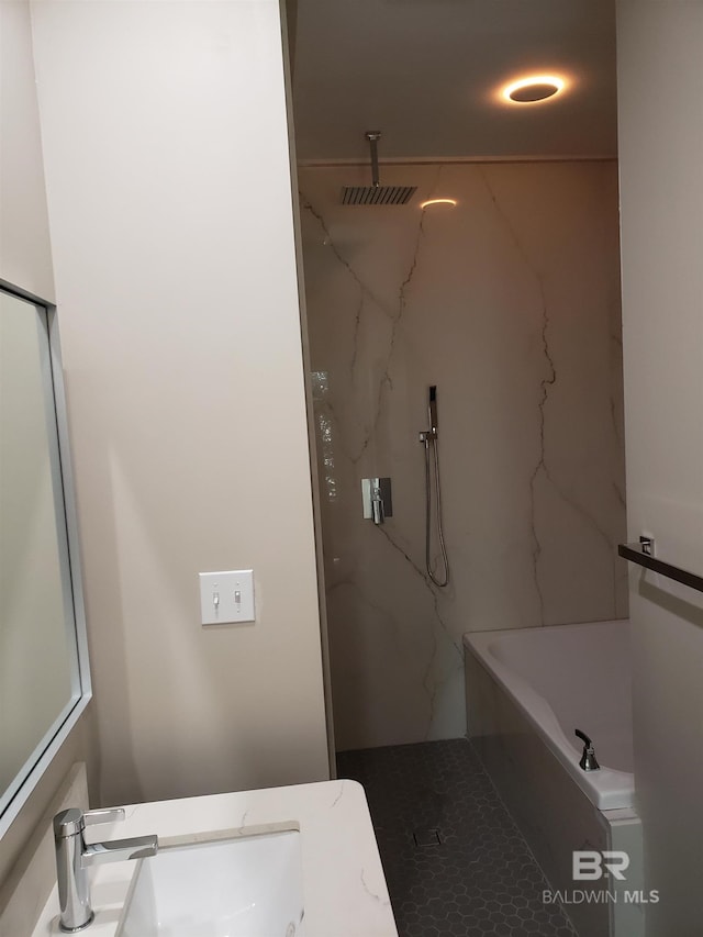 bathroom featuring vanity and shower with separate bathtub