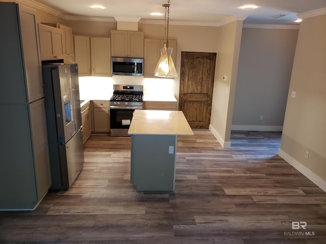 kitchen with dark hardwood / wood-style floors, hanging light fixtures, crown molding, a center island, and appliances with stainless steel finishes