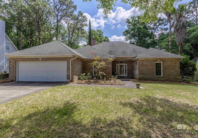 single story home featuring a shingled roof, an attached garage, brick siding, a front yard, and driveway