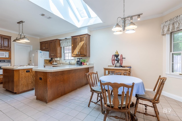 kitchen featuring light tile patterned floors, ornamental molding, white appliances, and visible vents
