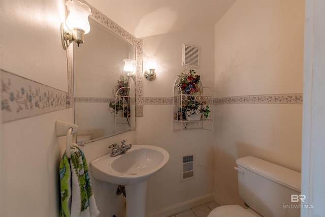 half bath featuring toilet and visible vents