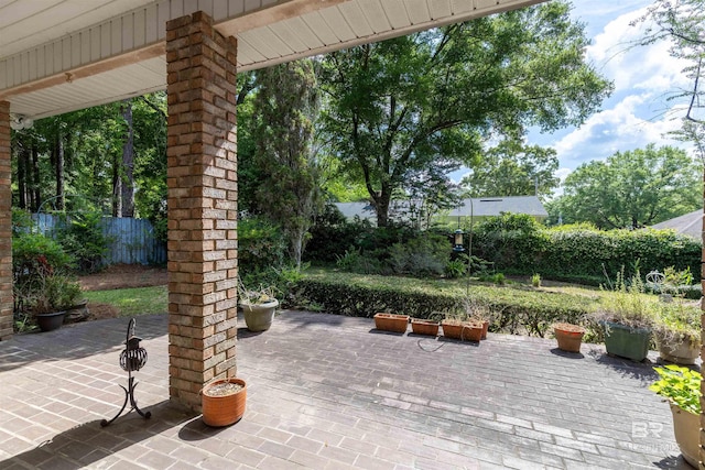 view of patio / terrace featuring fence