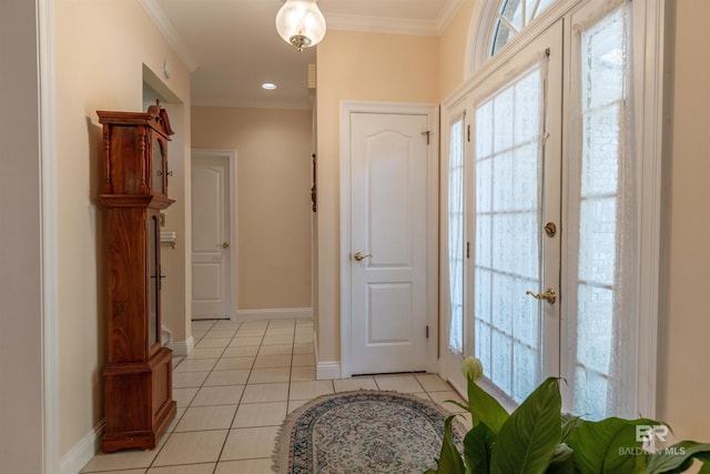 entryway featuring light tile patterned flooring, baseboards, and plenty of natural light