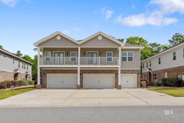 6877 Spaniel Dr Unit A, Spanish Fort, AL 36527 - view of front of house with brick siding, an attached garage, and driveway