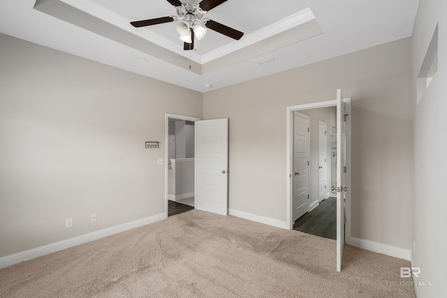 6877 Spaniel Dr Unit A, Spanish Fort, AL 36527 - unfurnished bedroom with a raised ceiling, visible vents, carpet flooring, and baseboards