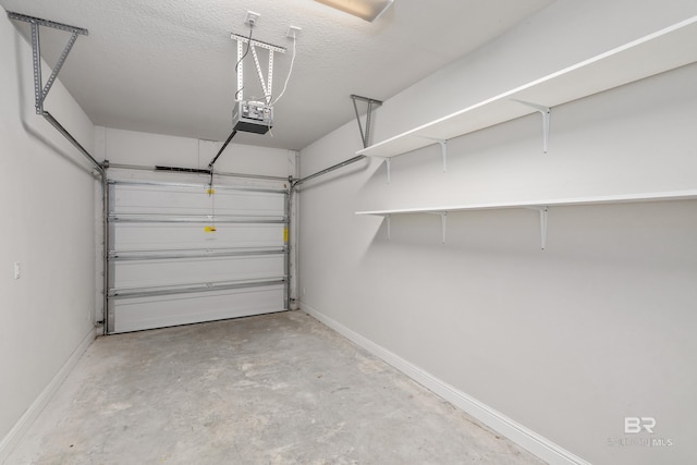 6877 Spaniel Dr Unit A, Spanish Fort, AL 36527 - garage with baseboards and a garage door opener