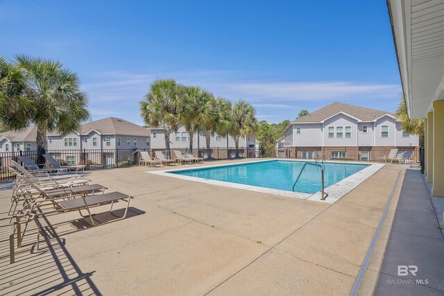 6877 Spaniel Dr Unit A, Spanish Fort, AL 36527 - community pool with a patio area, fence, and a residential view