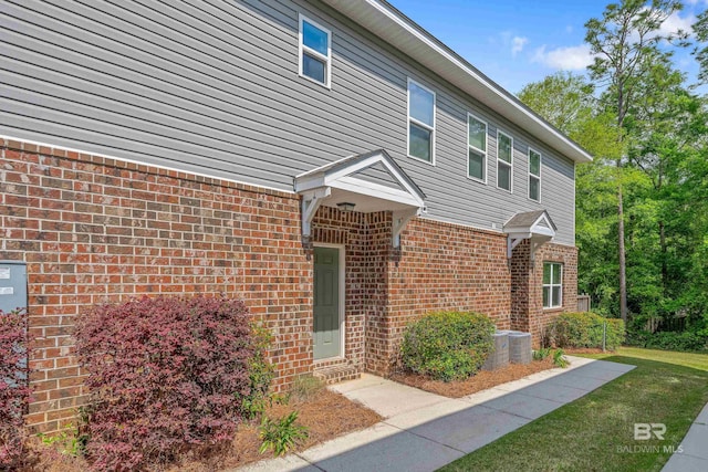 6877 Spaniel Dr Unit A, Spanish Fort, AL 36527 - view of front of home featuring a front lawn and brick siding