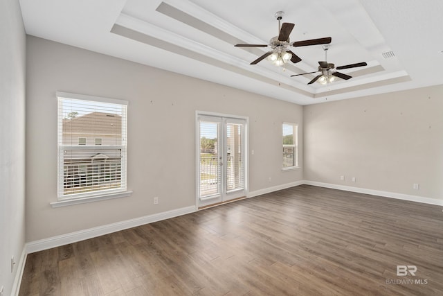 6877 Spaniel Dr Unit A, Spanish Fort, AL 36527 - spare room featuring baseboards, a ceiling fan, wood finished floors, and a raised ceiling