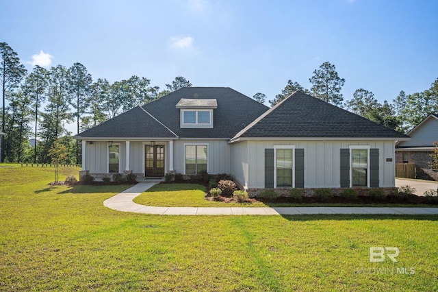 view of front facade with french doors, roof with shingles, board and batten siding, and a front lawn
