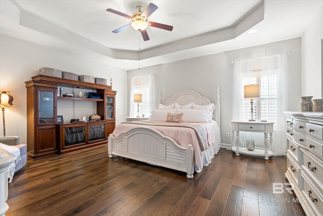 999 Weatherby St, Saraland, AL 36571 - bedroom featuring dark wood-style floors, a raised ceiling, multiple windows, recessed lighting, and a ceiling fan