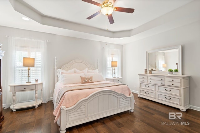 999 Weatherby St, Saraland, AL 36571 - bedroom with baseboards, dark wood-type flooring, multiple windows, and recessed lighting