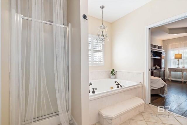 999 Weatherby St, Saraland, AL 36571 - full bathroom featuring plenty of natural light, a whirlpool tub, and a stall shower