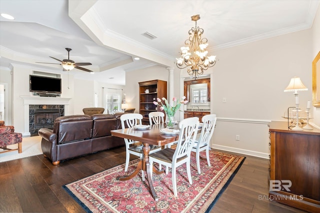 999 Weatherby St, Saraland, AL 36571 - dining area with plenty of natural light, dark wood-style flooring, ceiling fan, ornamental molding, and a premium fireplace