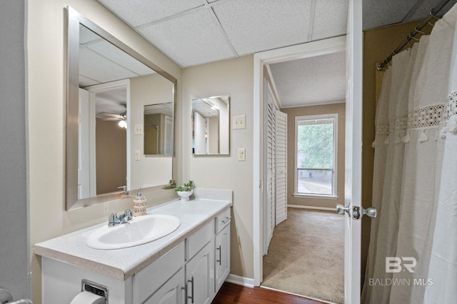 bathroom featuring ceiling fan, vanity, and hardwood / wood-style flooring