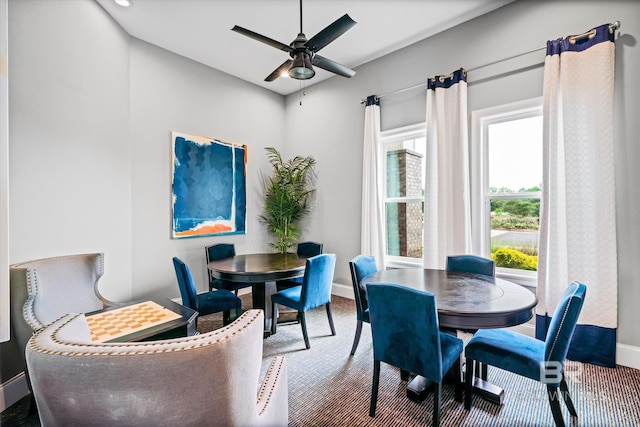 dining room featuring ceiling fan and baseboards