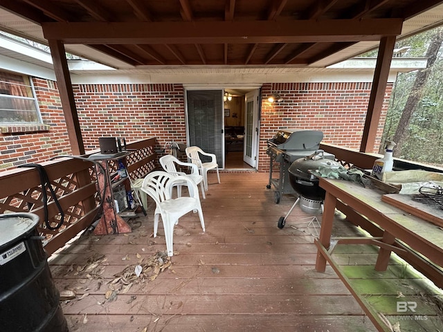 wooden deck featuring grilling area