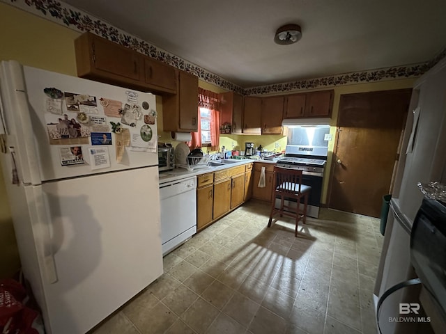 kitchen with white appliances and light countertops