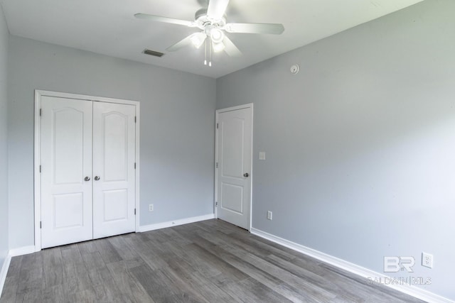 4005 Serene Ct, Foley, AL 36535 - unfurnished bedroom with wood finished floors, visible vents, a closet, and baseboards
