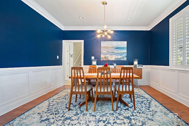 14 General Canby Dr, Spanish Fort, AL 36527 - dining space featuring a chandelier, wood finished floors, crown molding, and wainscoting