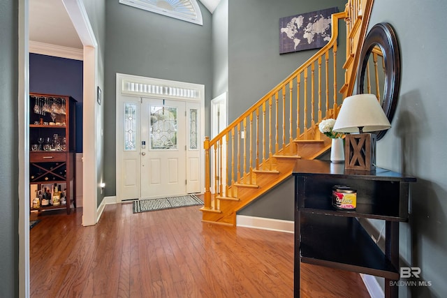 14 General Canby Dr, Spanish Fort, AL 36527 - entryway with stairway, a towering ceiling, hardwood / wood-style floors, and crown molding