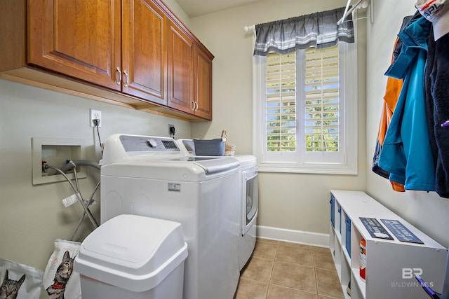 14 General Canby Dr, Spanish Fort, AL 36527 - washroom featuring cabinet space, independent washer and dryer, and light tile patterned floors