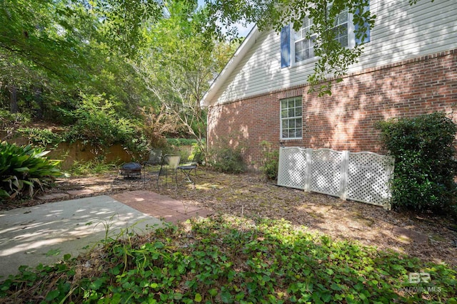 14 General Canby Dr, Spanish Fort, AL 36527 - view of yard featuring an outdoor fire pit and a patio