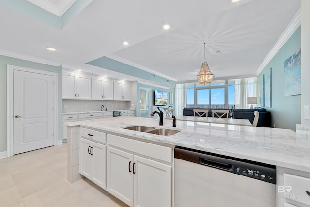 kitchen with crown molding, backsplash, white cabinets, a sink, and dishwasher