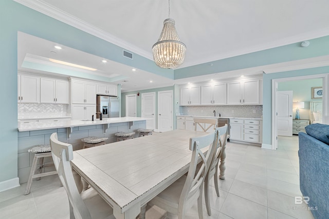 dining area featuring light tile patterned floors, recessed lighting, a raised ceiling, visible vents, and ornamental molding