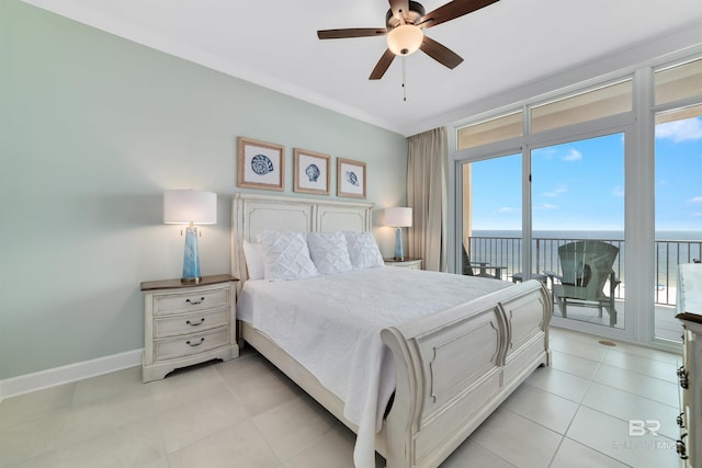 bedroom featuring baseboards, ceiling fan, a water view, access to exterior, and light tile patterned flooring