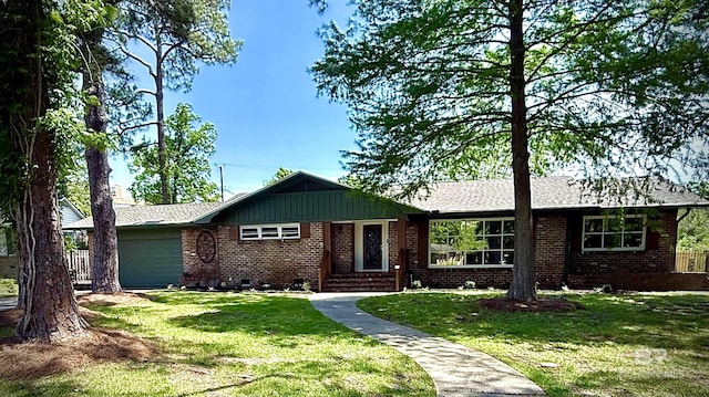 300 Indian Creek Dr, Mobile, AL 36607 - single story home featuring brick siding, an attached garage, a front lawn, and entry steps