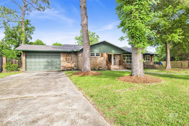 300 Indian Creek Dr, Mobile, AL 36607 - view of front of house with brick siding, a garage, and concrete driveway