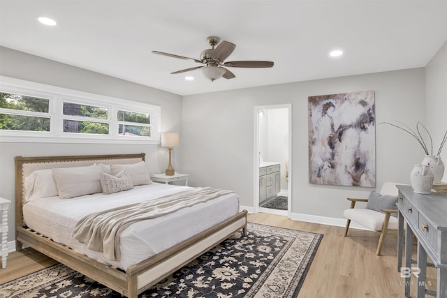 300 Indian Creek Dr, Mobile, AL 36607 - bedroom with light wood-style floors, baseboards, recessed lighting, ensuite bath, and a ceiling fan