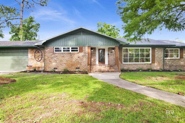 300 Indian Creek Dr, Mobile, AL 36607 - ranch-style house with brick siding, an attached garage, a front lawn, and crawl space