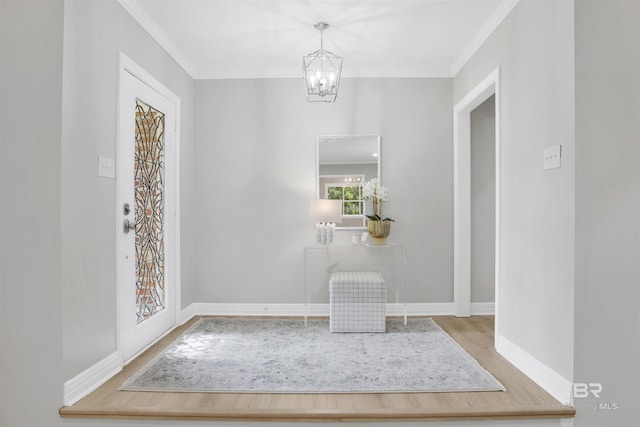 300 Indian Creek Dr, Mobile, AL 36607 - entryway featuring wood finished floors, ornamental molding, a chandelier, and baseboards