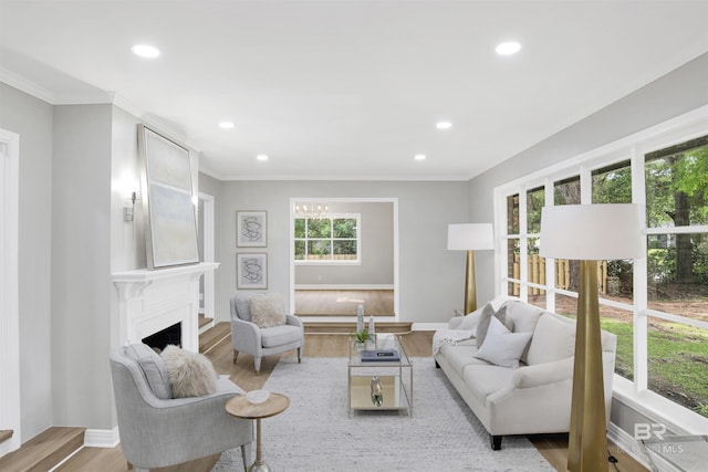 300 Indian Creek Dr, Mobile, AL 36607 - living room featuring recessed lighting, wood finished floors, baseboards, a fireplace, and ornamental molding