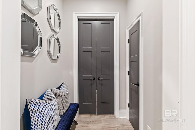 mudroom with light hardwood / wood-style floors