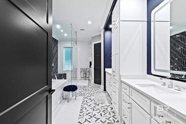 bathroom featuring a shower with door, ornamental molding, and sink