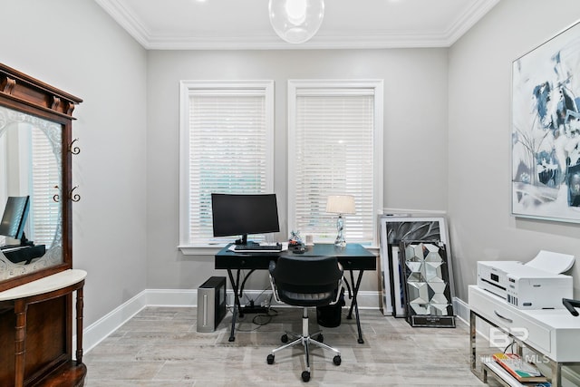 home office with crown molding and light hardwood / wood-style floors