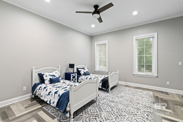 bedroom with crown molding, parquet flooring, and ceiling fan