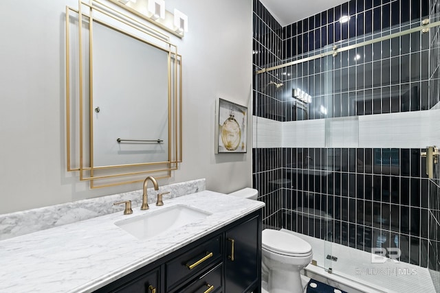 bathroom with vanity, walk in shower, and toilet