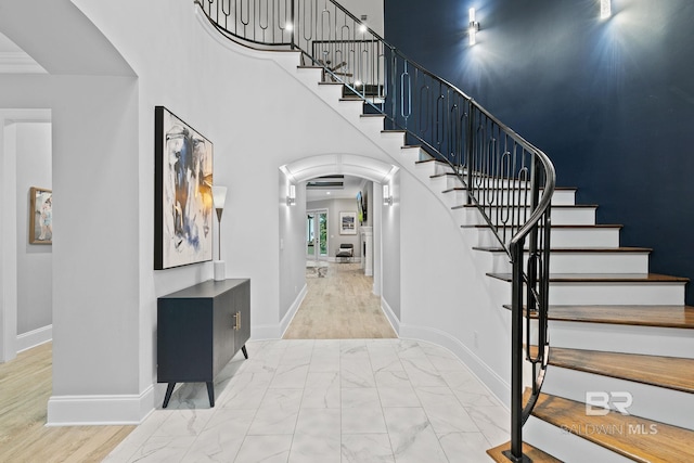 entryway with a towering ceiling