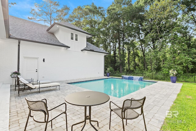 view of pool featuring a patio and pool water feature