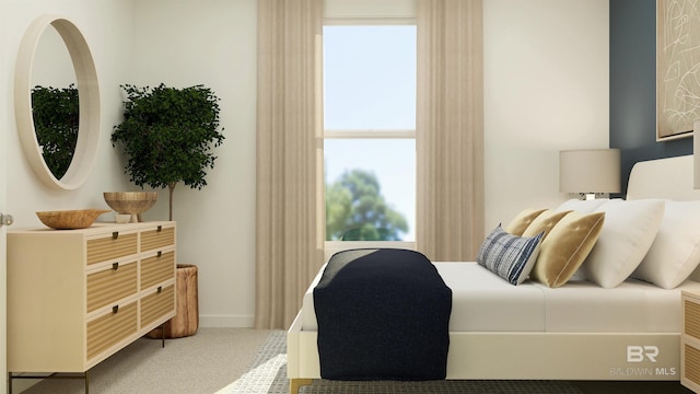 carpeted bedroom with baseboards